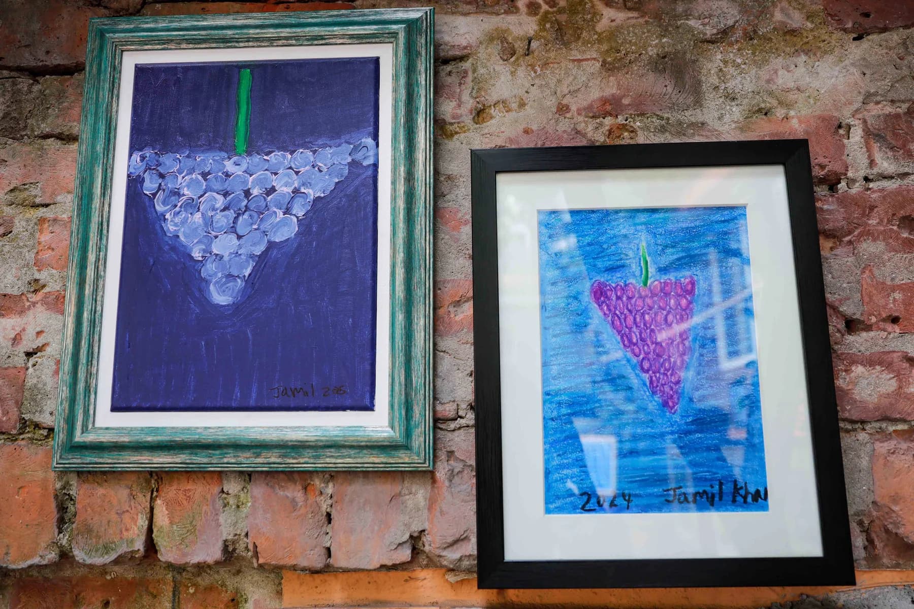 Two framed works on the garden wall — Imagination, a presentation of work by Jamil Khan at Gallery Cosmos