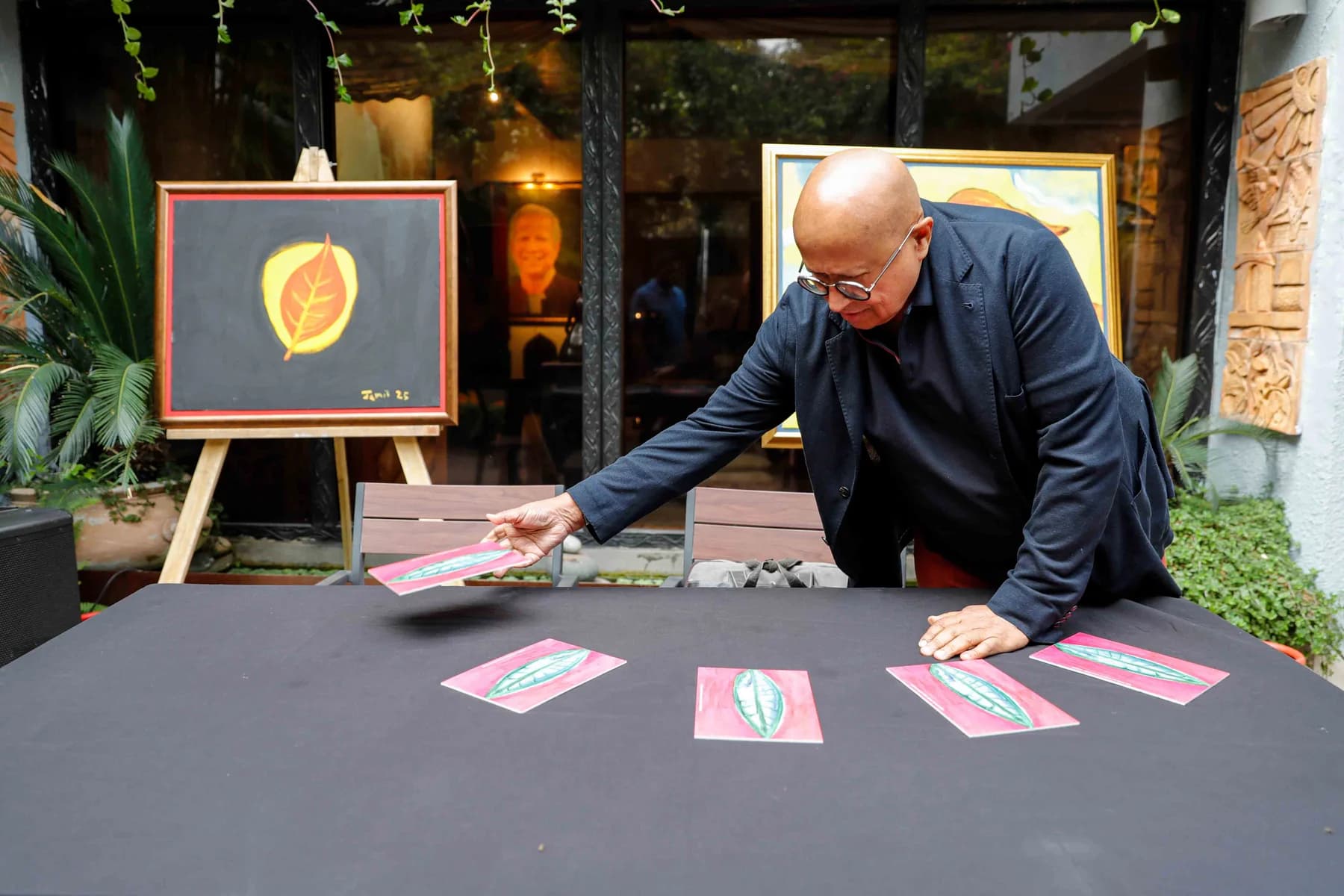 Preparing the exhibition table — Imagination, a presentation of work by Jamil Khan at Gallery Cosmos
