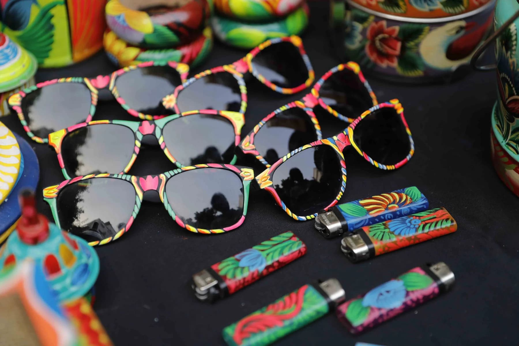 Hand-painted sunglasses and lighters — Rickshaw Art Exhibition at Gallery Cosmos